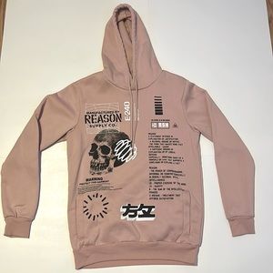 Pink Reason throw over sweatshirt.